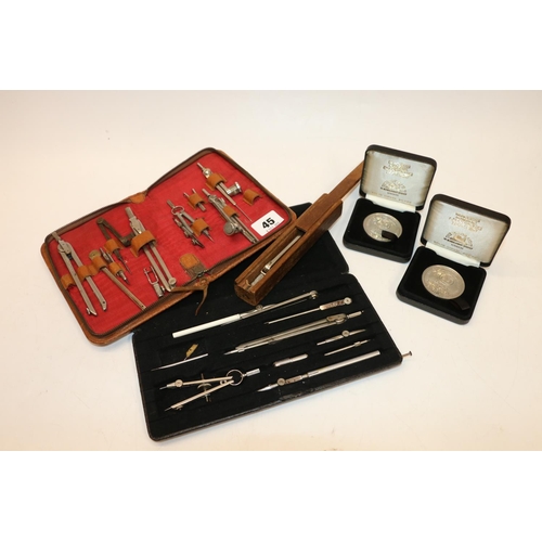 45 - Collection of technical drawing instruments and two Gleneagles coins.