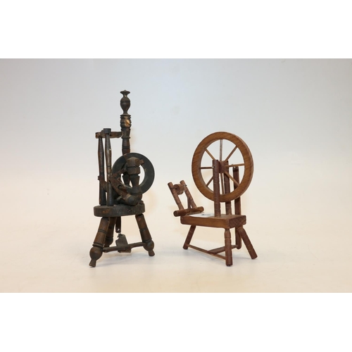 5 - Two miniature treen models of spinning wheels, 17cm.