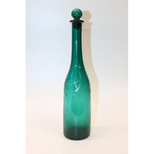 56 - Victorian green glass bottle decanter with etched grape decoration. 35cm.