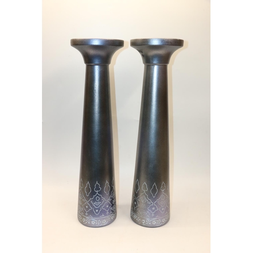 67 - Pair of large ceramic plant or candle stands with floral decoration, 62.5cm.