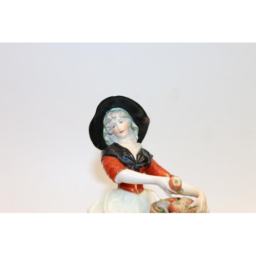 93 - Meissen figurine of a girl carrying a basket of apples and a continental porcelain figurine of a gir... 