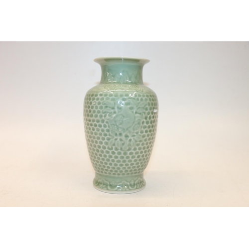 94 - Oriental celadon glazed vase, six character mark to base, 20cm.