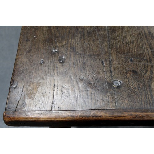 404 - 17th century style oak refectory table, with fixed plank top, above a carved frieze, raised on turne... 