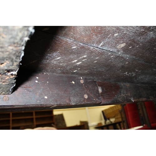 404 - 17th century style oak refectory table, with fixed plank top, above a carved frieze, raised on turne... 