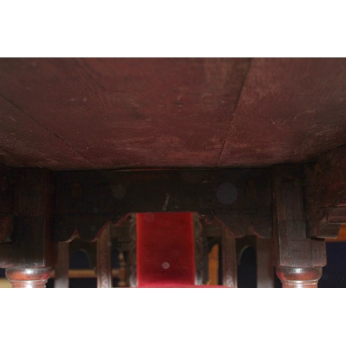 404 - 17th century style oak refectory table, with fixed plank top, above a carved frieze, raised on turne... 