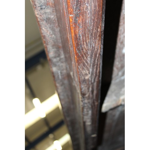 404 - 17th century style oak refectory table, with fixed plank top, above a carved frieze, raised on turne... 