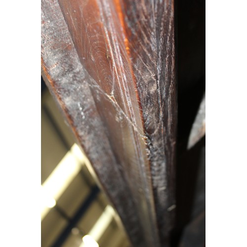 404 - 17th century style oak refectory table, with fixed plank top, above a carved frieze, raised on turne... 