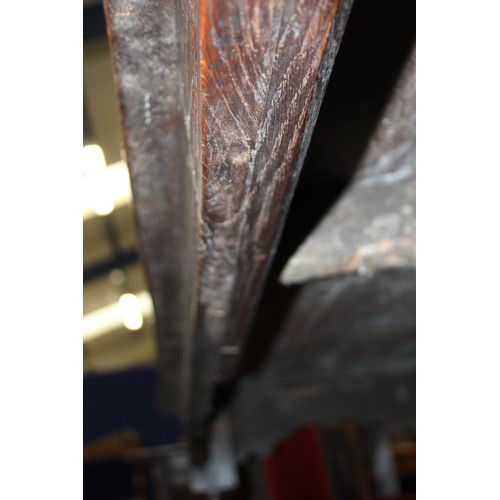 404 - 17th century style oak refectory table, with fixed plank top, above a carved frieze, raised on turne... 