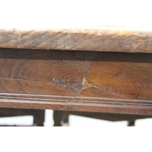 404 - 17th century style oak refectory table, with fixed plank top, above a carved frieze, raised on turne... 