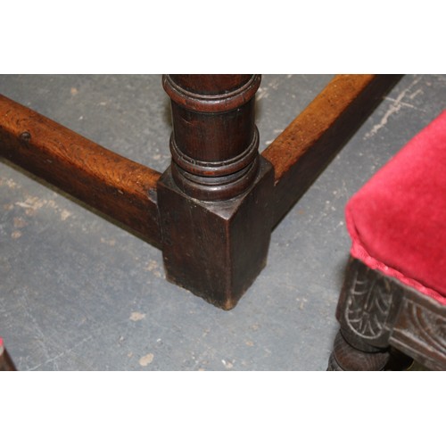 404 - 17th century style oak refectory table, with fixed plank top, above a carved frieze, raised on turne... 