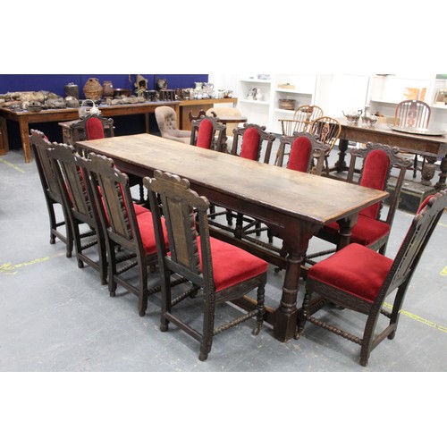 404 - 17th century style oak refectory table, with fixed plank top, above a carved frieze, raised on turne... 