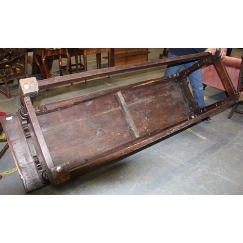 404 - 17th century style oak refectory table, with fixed plank top, above a carved frieze, raised on turne... 