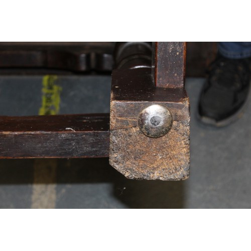 404 - 17th century style oak refectory table, with fixed plank top, above a carved frieze, raised on turne... 