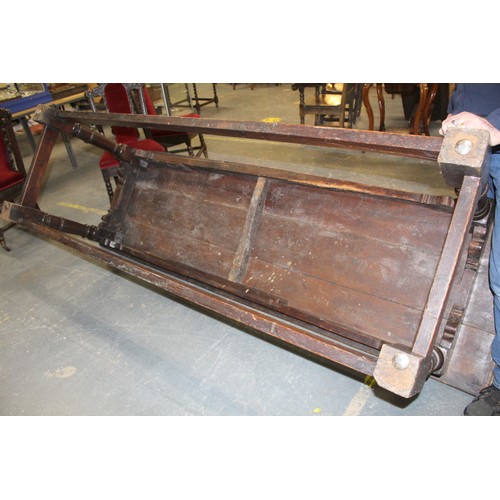 404 - 17th century style oak refectory table, with fixed plank top, above a carved frieze, raised on turne... 