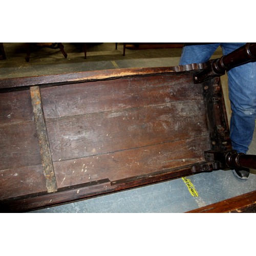 404 - 17th century style oak refectory table, with fixed plank top, above a carved frieze, raised on turne... 