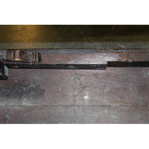 404 - 17th century style oak refectory table, with fixed plank top, above a carved frieze, raised on turne... 