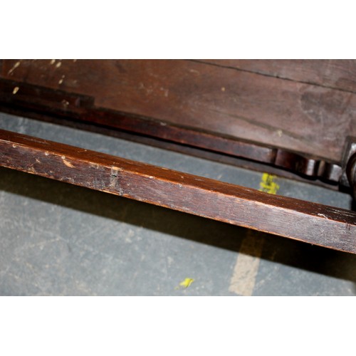 404 - 17th century style oak refectory table, with fixed plank top, above a carved frieze, raised on turne... 