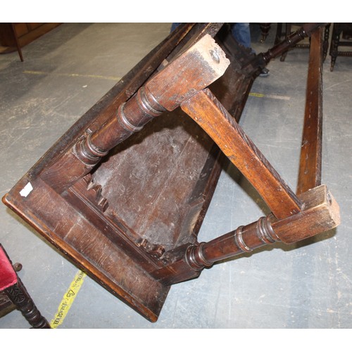 404 - 17th century style oak refectory table, with fixed plank top, above a carved frieze, raised on turne... 