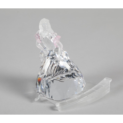 22 - Swarovski crystal model of a lady; on frosted glass base; 10cm high