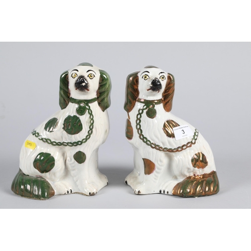 3 - Pair of late Victorian Staffordshire pottery seated dogs; 20.5cm high