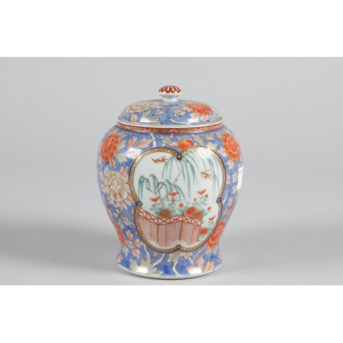 6 - Chinese Imari porcelain ginger jar and cover; decorated with garden scenes; 17cm high