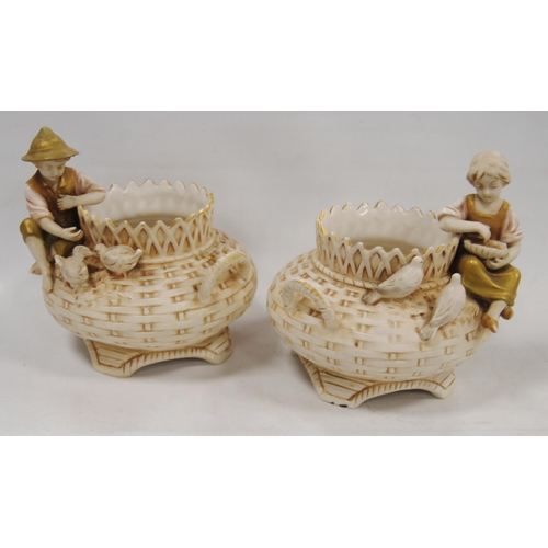 230 - Pair of Royal Dux twin-handled figural vases of basket-weave design, with a surmount of a boy and a ... 