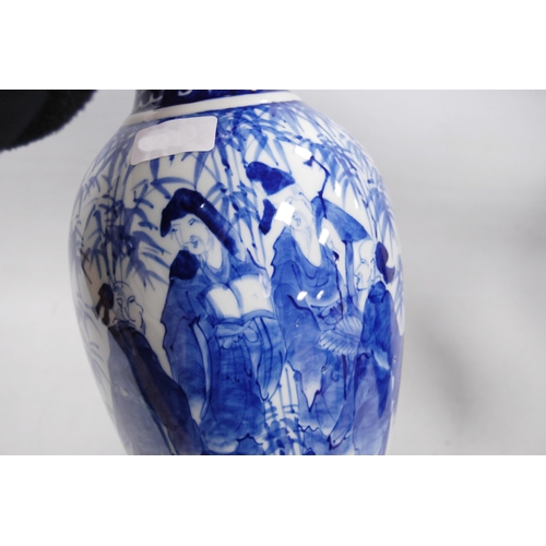 278 - Pair of Delft-style blue and white vases in the Japanese taste, decorated with figures in foliage, u... 