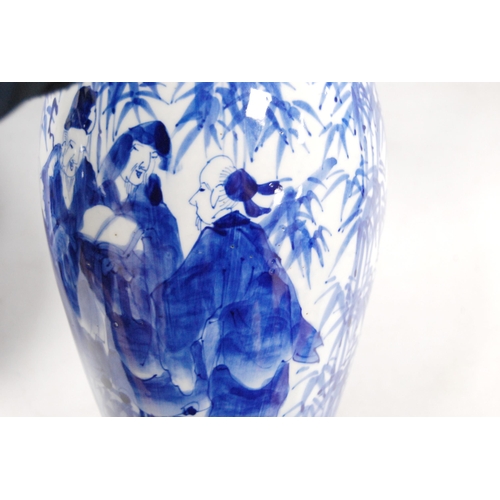 278 - Pair of Delft-style blue and white vases in the Japanese taste, decorated with figures in foliage, u... 