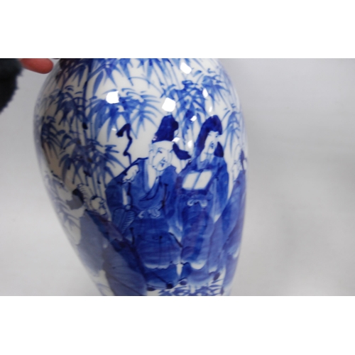 278 - Pair of Delft-style blue and white vases in the Japanese taste, decorated with figures in foliage, u... 