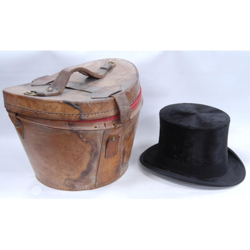 179 - Black silk top hat retailed by Dunn & Co., Strand, London, internal diameter 15.5cm x 19.5cm, wi... 