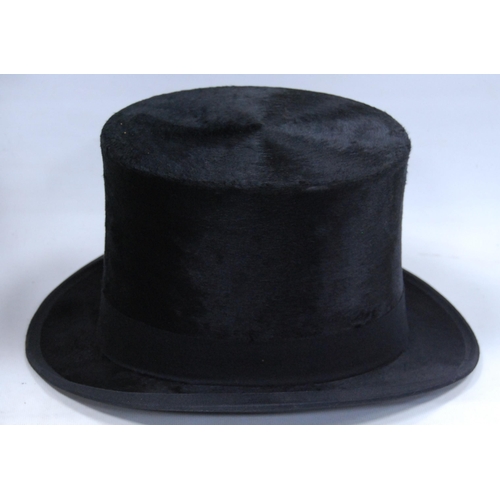 179 - Black silk top hat retailed by Dunn & Co., Strand, London, internal diameter 15.5cm x 19.5cm, wi... 