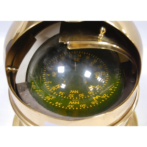 181 - Nauticalia: gimble liquid compass enclosed in a brass binnacle case, drilled to the base for mountin... 