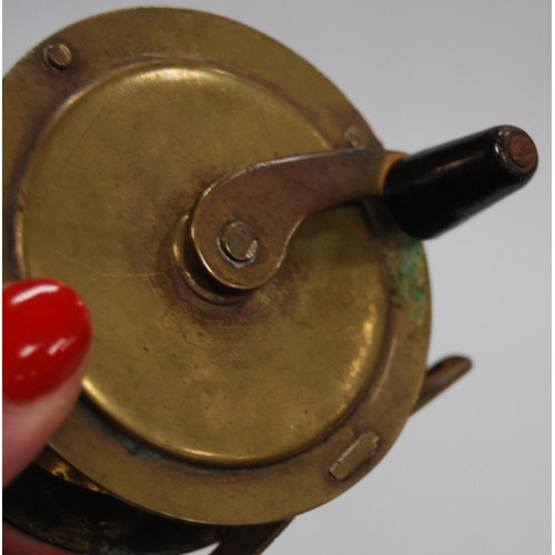 191 - Fishing interest: Hardy Bros patent reel with ivorine handle, and a vintage brass reel.  (2)... 