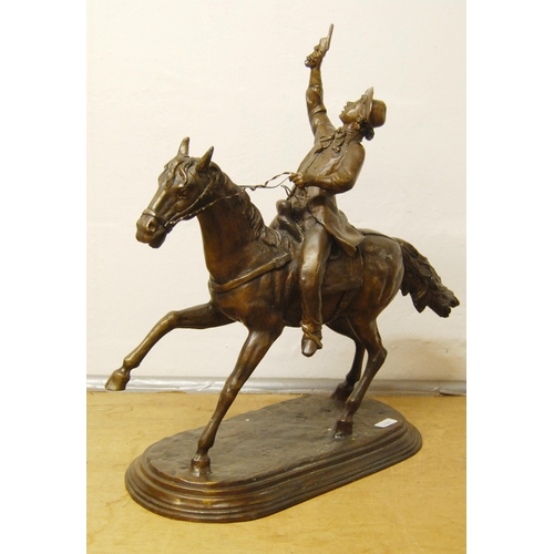 198 - In the Manner of Frederick RemingtonCast bronze figure group modelled as a cowboy on horseback, on f... 