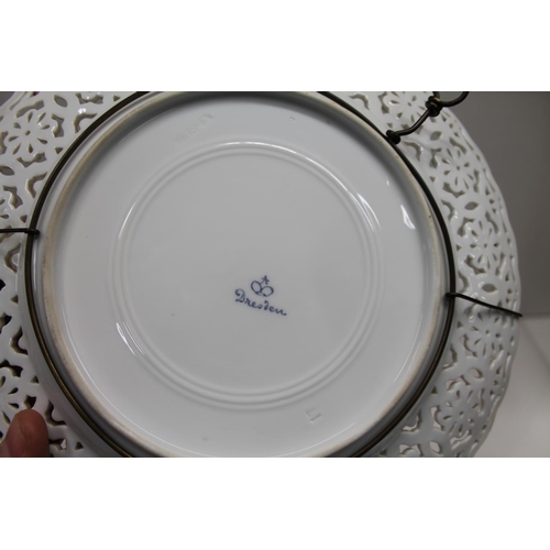 100D - Dresden cabinet plate decorated with central period scene & heavily pierced rim, 26cm.