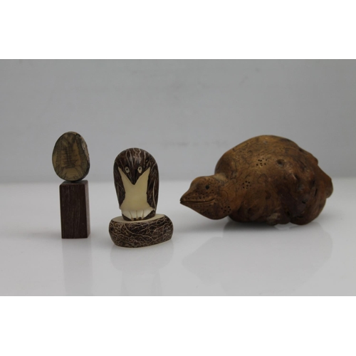 11 - Tagua nut 'Pinguino' carving, two Tagua nut with scrimshaw decoration & a rustic animal carving,... 