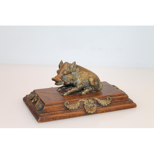 13 - Brass hog model mounted on walnut plinth, 16.5cm.