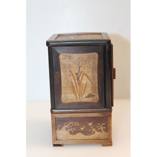 2 - Japanese smokers' box or cigarette box decorated with marquetry inlaid scenes on each panel, 16cm.