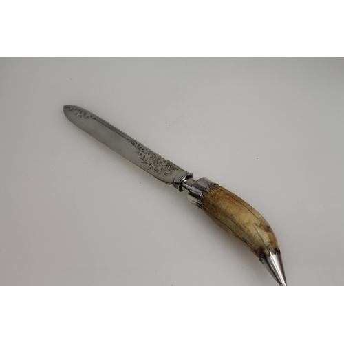 20 - Silver plated cake knife with marine ivory handle, 28cm.