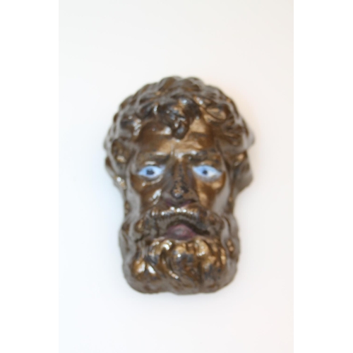 27 - Cast metal bust of a bearded gentleman, 13cm.