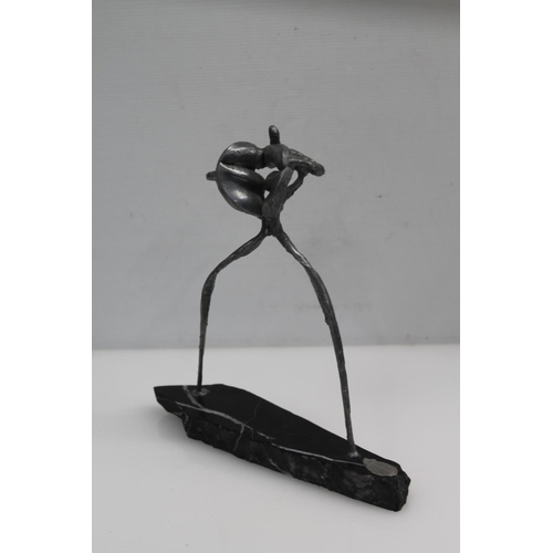 31 - John Cotter abstract sculpture of a figure with oversized hands, 24cm.