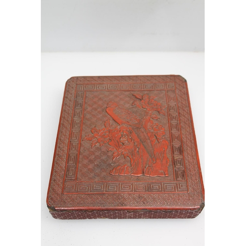 40 - Oriental cinnabar box decorated with bird perched in a tree, 24cm.