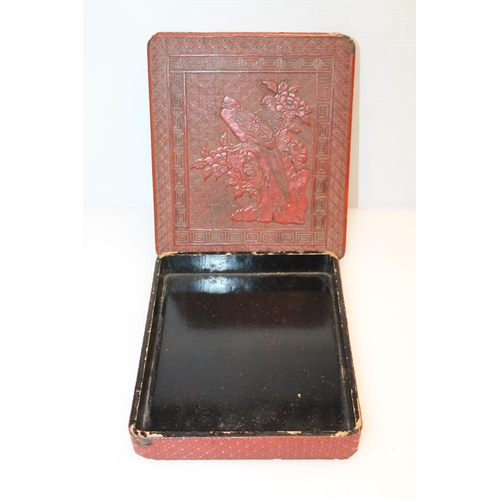 40 - Oriental cinnabar box decorated with bird perched in a tree, 24cm.