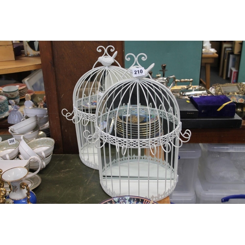 210 - Pair of mirror back candle / ornament cream painted cages.