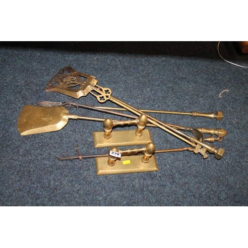 278 - Brass fire irons with stand.