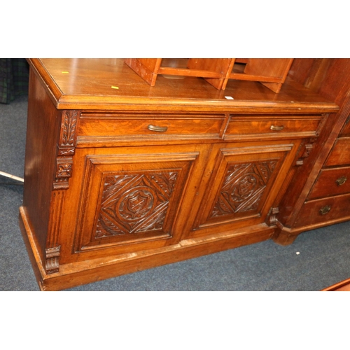 722 - Oak sideboard, with heavily carved doors, 140cm x 90cm.