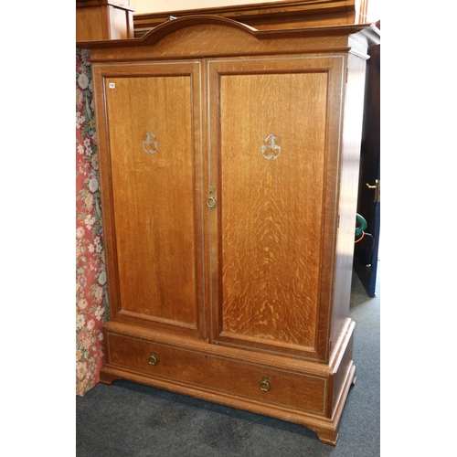 725 - Oak Art Nouveau two door wardrobe, with single drawer, 186cm x 140cm.