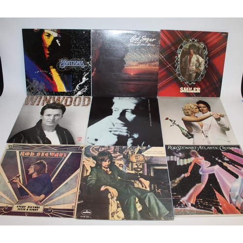 305 - Collection of mainly 70's records to include a collection of Joni Mitchell, Eric Clapton, Bob Seger,... 