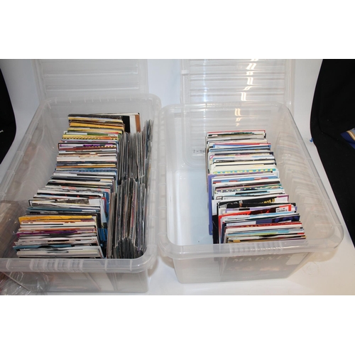 338 - Two boxes containing a vast collection of singles mainly from the 80's and 90's to include Madness, ... 