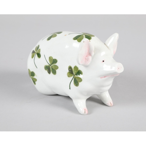 13 - Wemyss pottery seated pig; decorated with shamrocks; marks to base; 9.5cm high